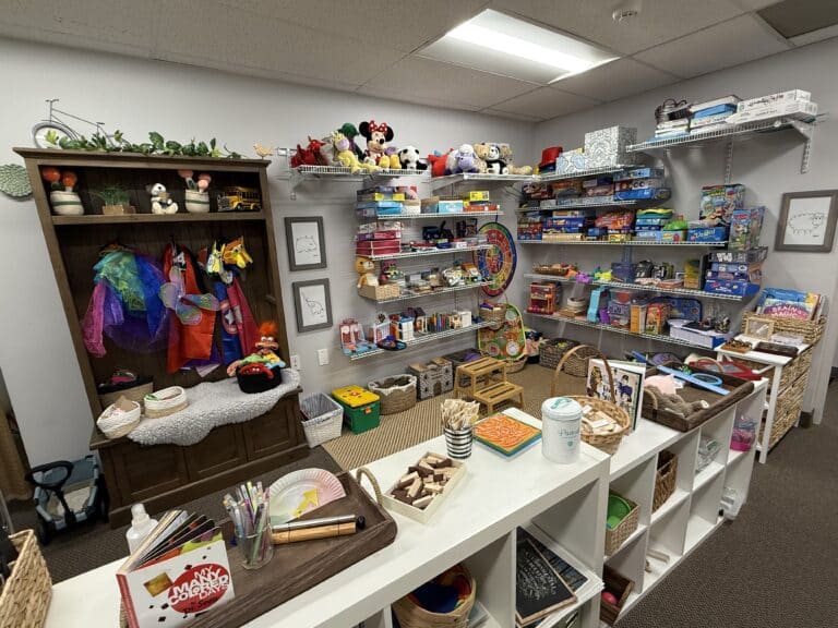 room with many colorful toys and games for play therapy